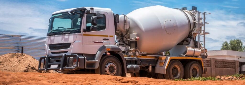 Ready mix concrete truck delivering fresh concrete on site