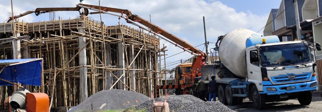 A truck Ready Mix Concrete supplying concrete on site